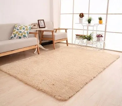 White solid colour rectangular plush area rug with non-slip dot base on wooden floor