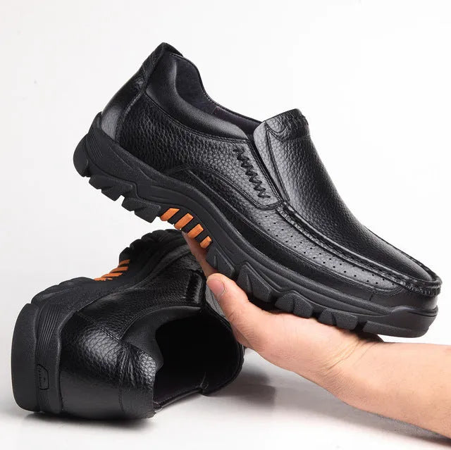 Men's black cowhide leather slip-on business casual shoes with a rubber sole.