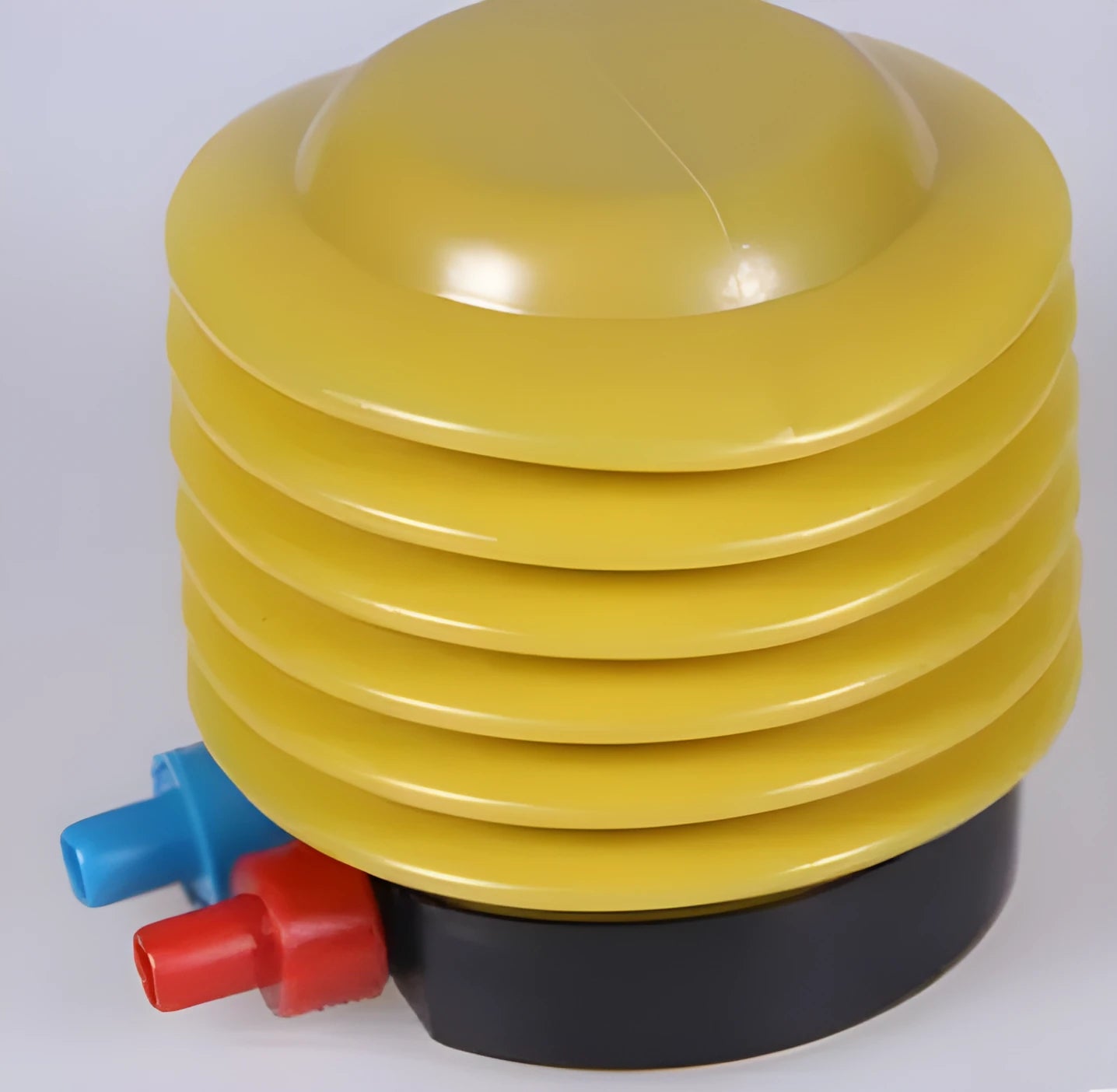 Blue and red plastic pedal foot pump for inflating swim rings with 4-inch diameter