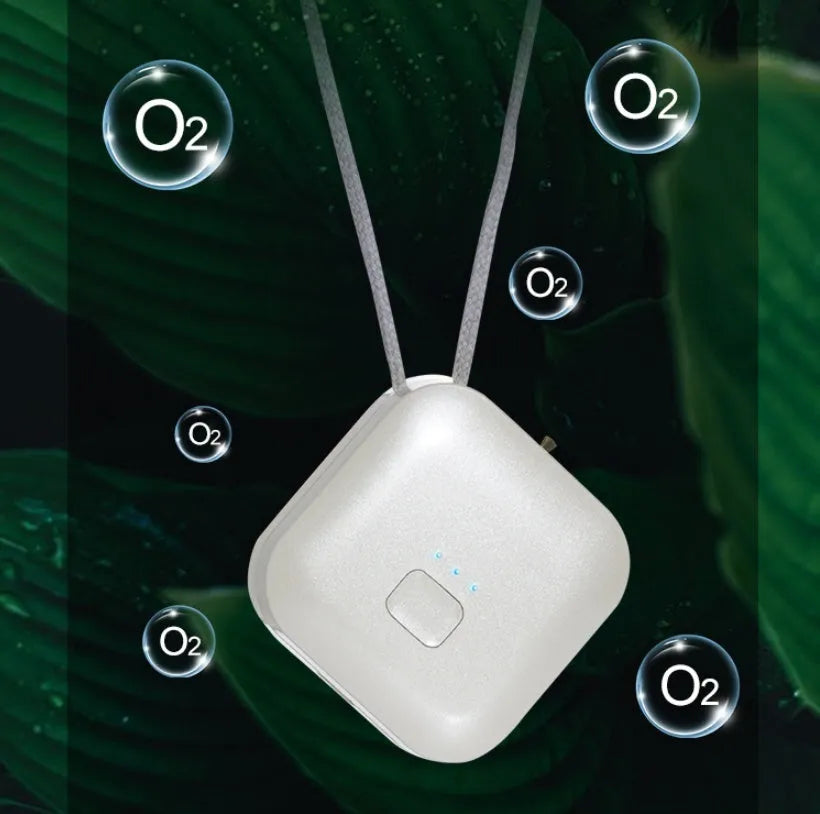 Mini USB air purifier necklace in pink showing compact wearable design with one-button control