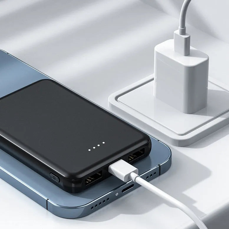 Black universal USB power bank for electric heating vests showing compact size.