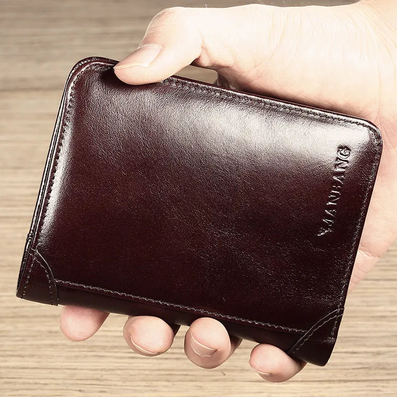 Men's black leather bifold wallet open to show internal card slots, photo window, coin pocket, and banknote compartment.