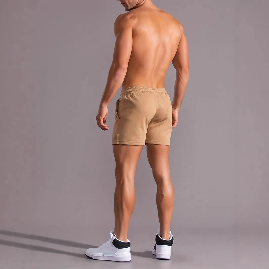 Men's khaki coconut print sports shorts with elastic waistband and straight leg cut