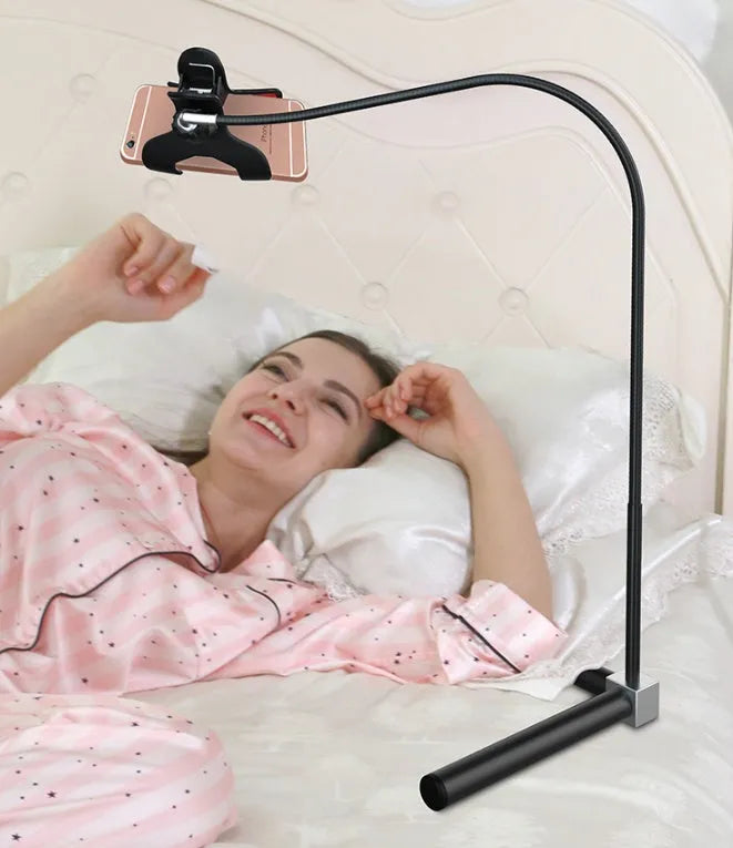 Black and white universal mobile phone holder shown as a bedside bracket and an under-bed floor stand.
