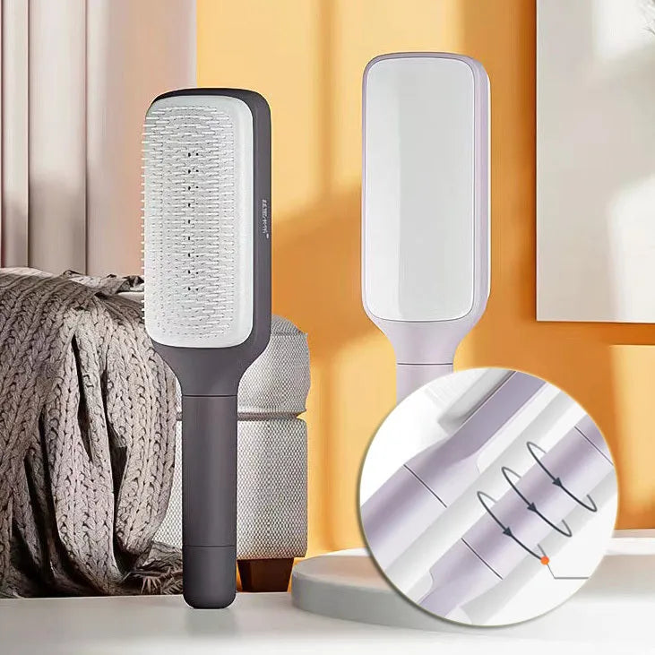 Self-cleaning hair brush with rotating handle, anti-static teeth and scalp massage points in purple and grey colours