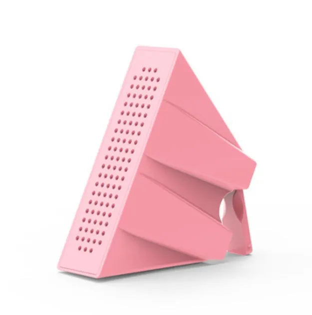 Portable Apple-compatible phone amplifier bracket in multiple colours on desktop