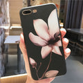 Black embossed flower design on a slim TPU iPhone case for iPhone 11.