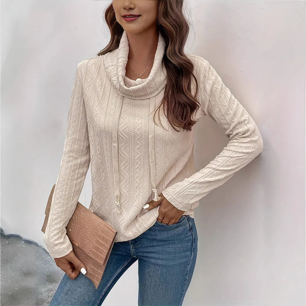 Apricot coloured hooded pullover sweater with drawstring and long sleeves laid flat