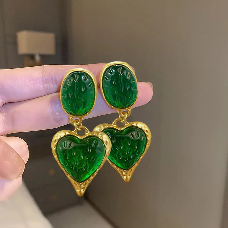 Silver needle pleated oval love heart stud earrings in alloy, showing green, purple, red, and yellow and white colour options.