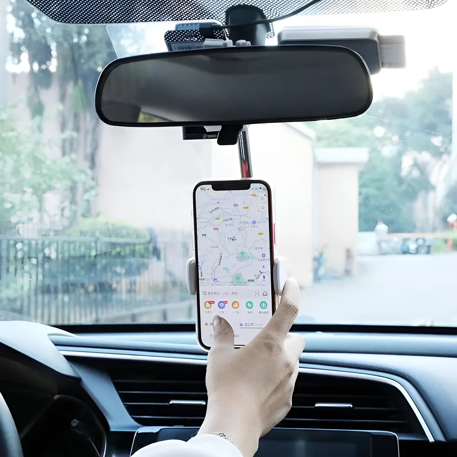Black ABS plastic mobile phone bracket mounted on a car rearview mirror stem.