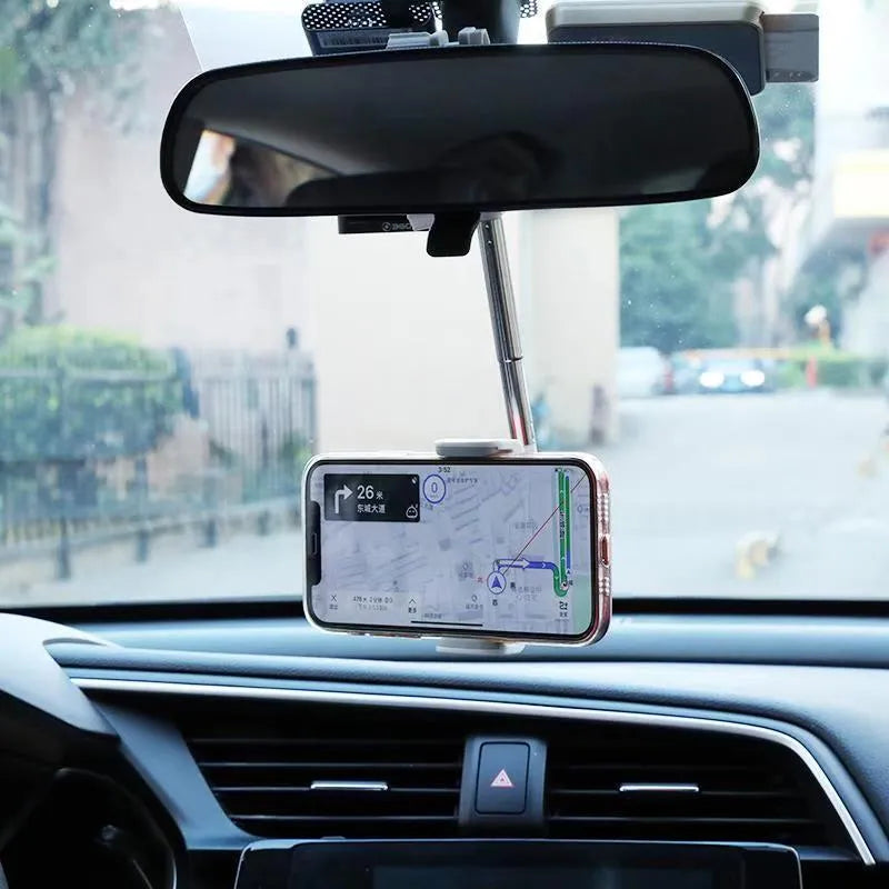 Black ABS plastic mobile phone bracket mounted on a car rearview mirror stem.