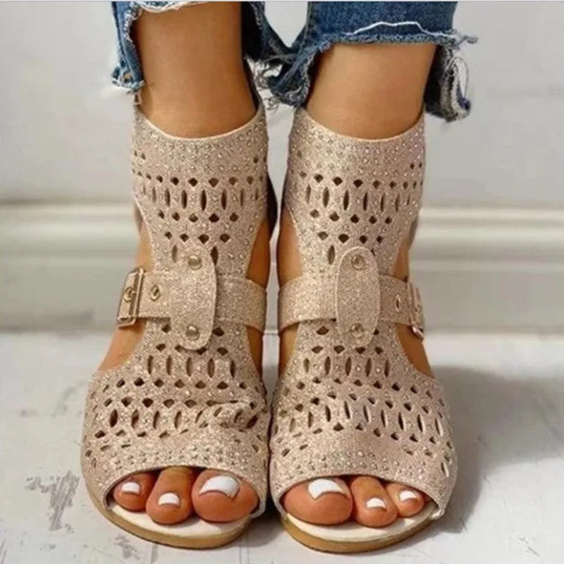 Women's beige flat sandals with rivet details, fish mouth toe, back zipper, and wedge heel