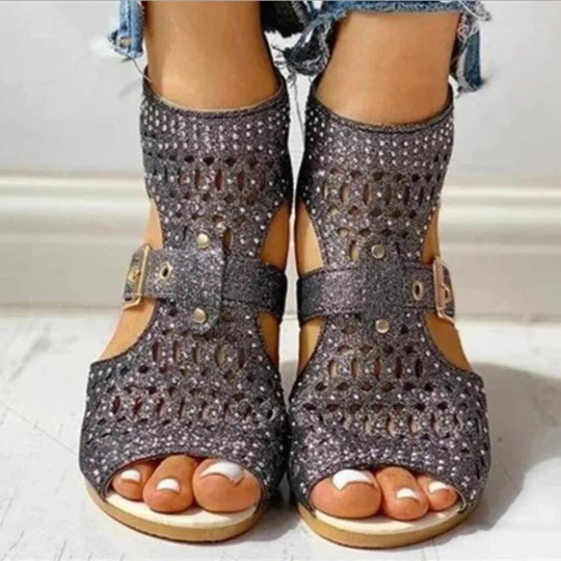 Women's beige flat sandals with rivet details, fish mouth toe, back zipper, and wedge heel