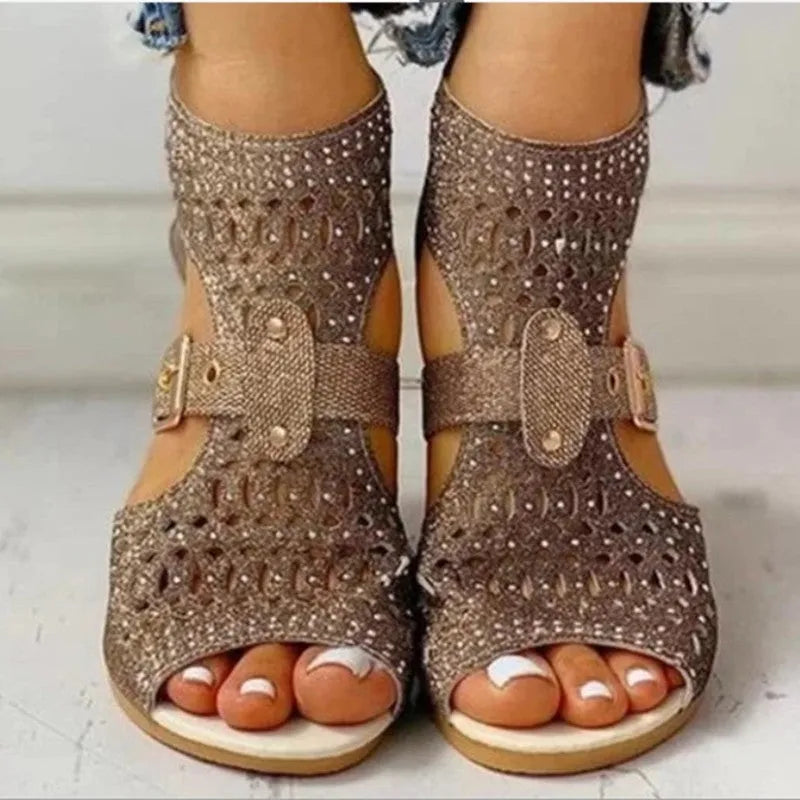 Women's beige flat sandals with rivet details, fish mouth toe, back zipper, and wedge heel