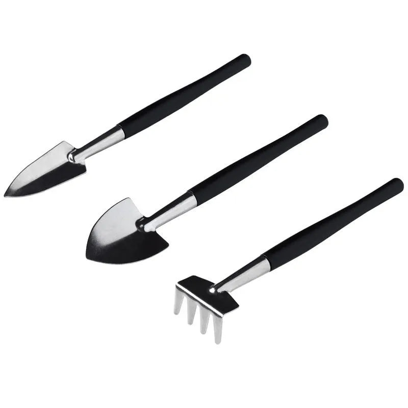 Black plastic and metal 16-piece mini garden hand tool set for succulents and bonsai, displayed with cushion.