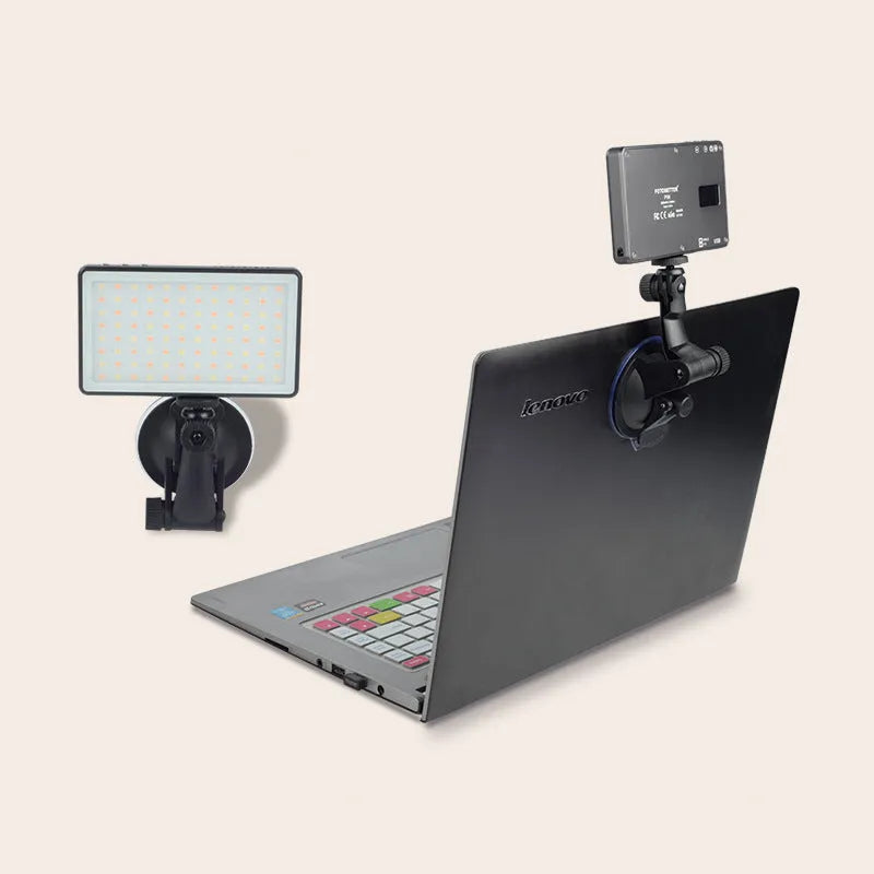Black aluminium alloy LED video light for laptops with 96 LEDs and a display screen.