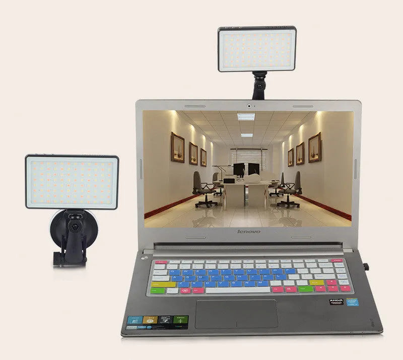 Black aluminium alloy LED video light for laptops with 96 LEDs and a display screen.