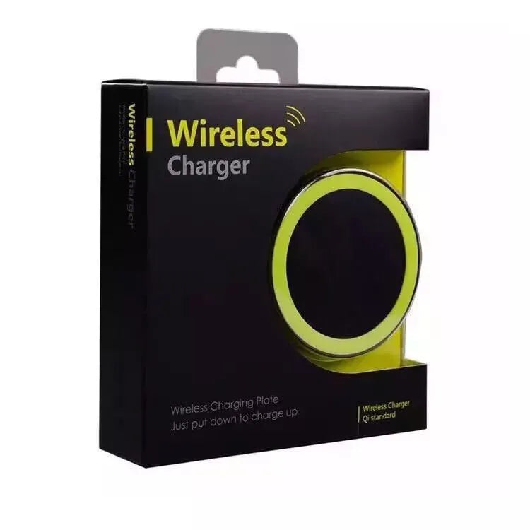 Square Qi wireless phone charging pad in multiple colours on a wooden surface.