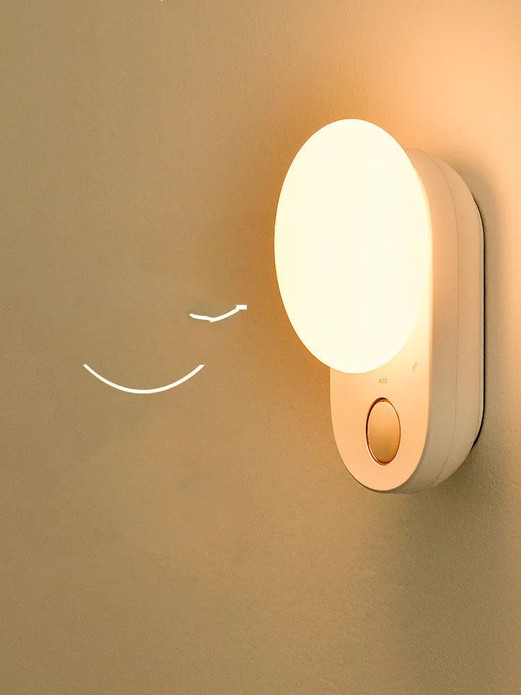 White rechargeable bedside night light with motion sensor and USB charging port