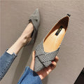 Women's pointed-toe shallow-cut single shoes in black or red colours with cotton uppers and low flat heels