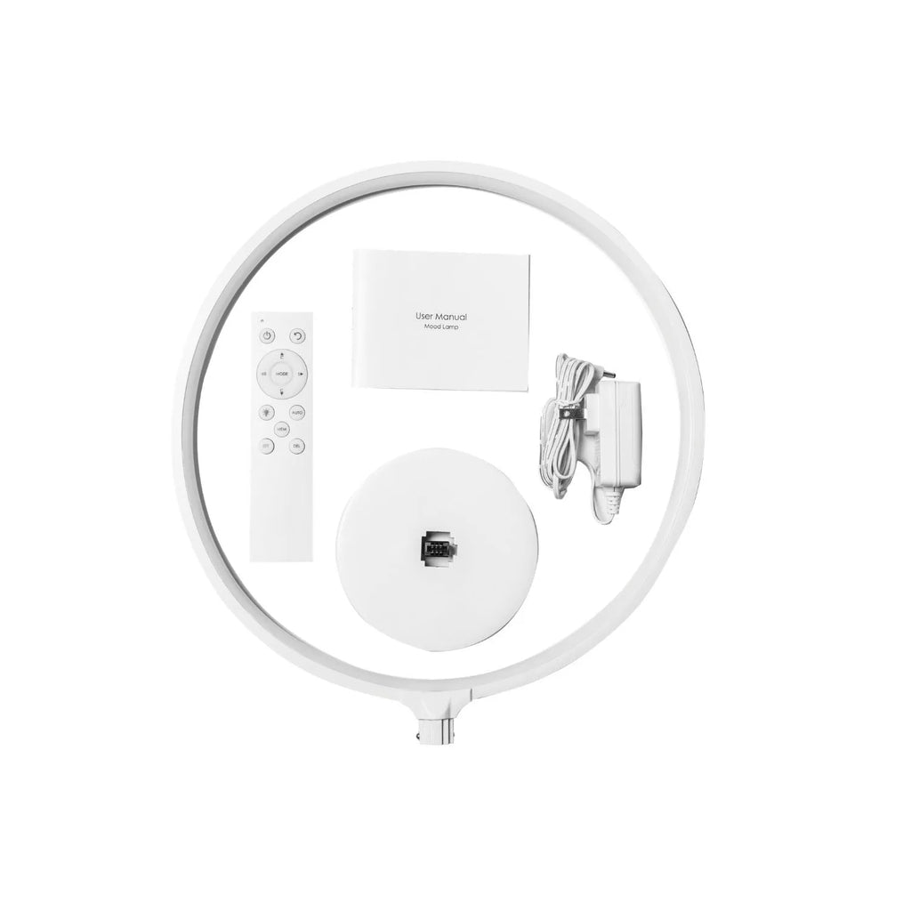 White Full Moon Table Lamp with remote control on a wooden surface, showing its spherical silicone and aluminium design.