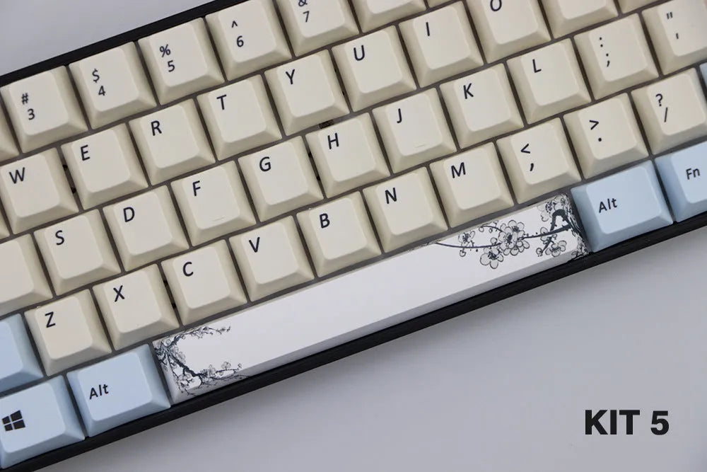 Single PBT plastic 6.25U space bar keycap for mechanical keyboards, shown in a selection of colours with dye-sublimated outline design.