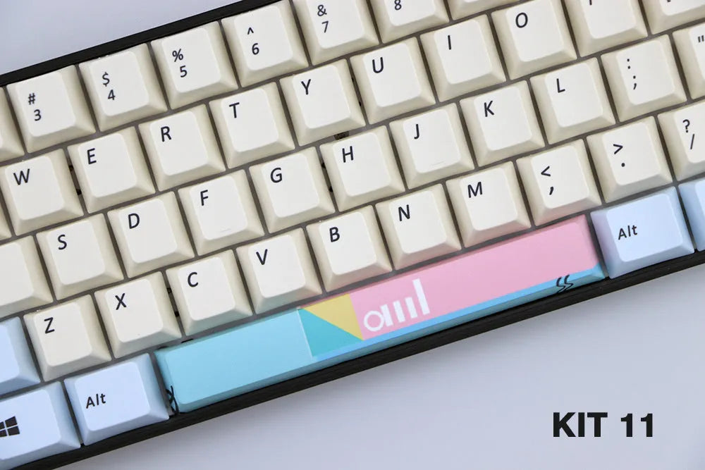 Single PBT plastic 6.25U space bar keycap for mechanical keyboards, shown in a selection of colours with dye-sublimated outline design.