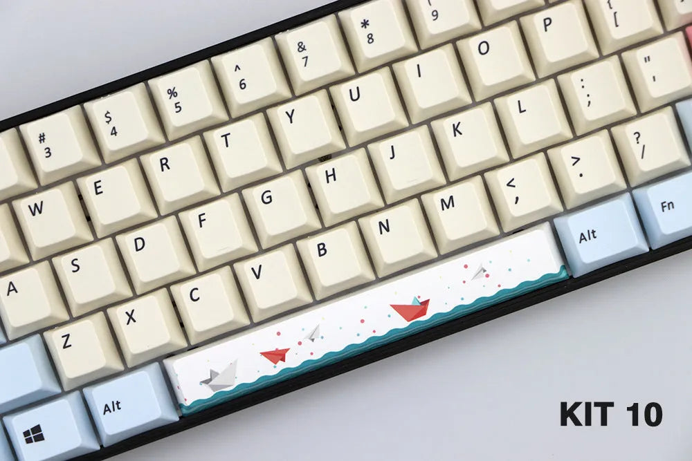 Single PBT plastic 6.25U space bar keycap for mechanical keyboards, shown in a selection of colours with dye-sublimated outline design.