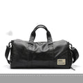 Large black PU leather sports training bag showing multiple internal compartments including a laptop sleeve.