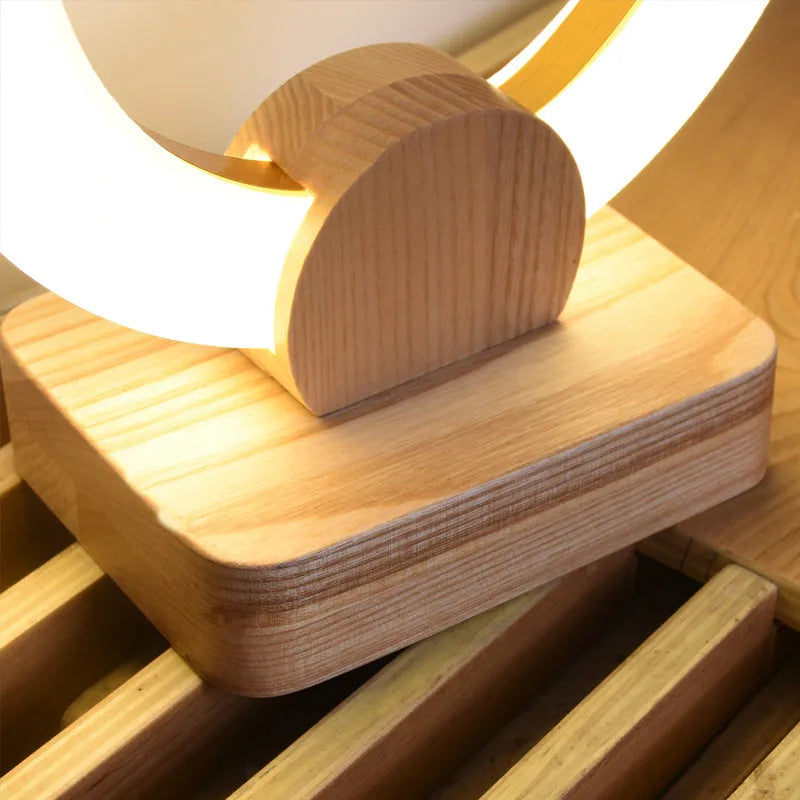 Nordic style wooden circular chandelier with round acrylic shade, shown in 20cm and 30cm diameter options.