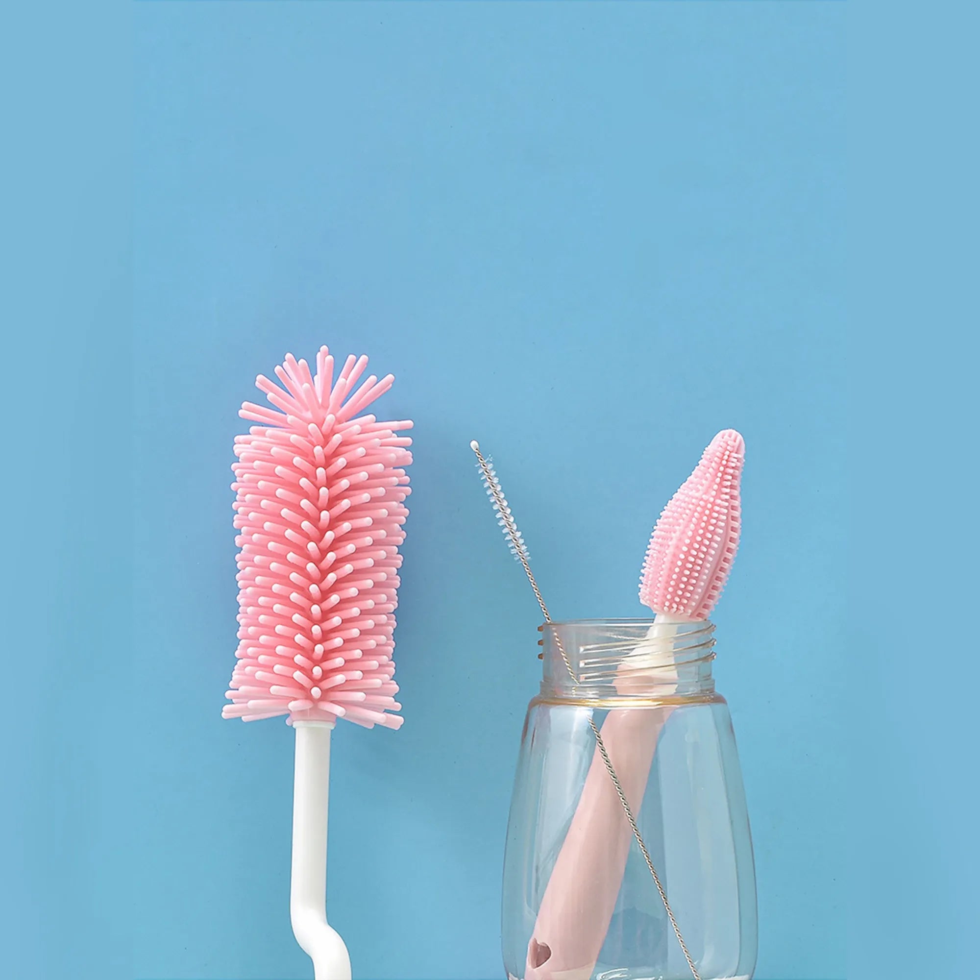 Silicone baby bottle brush and straw cleaning tool set in assorted colours.