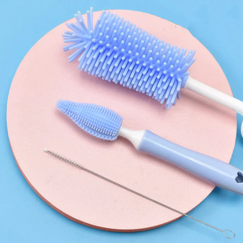 Silicone baby bottle brush and straw cleaning tool set in assorted colours.