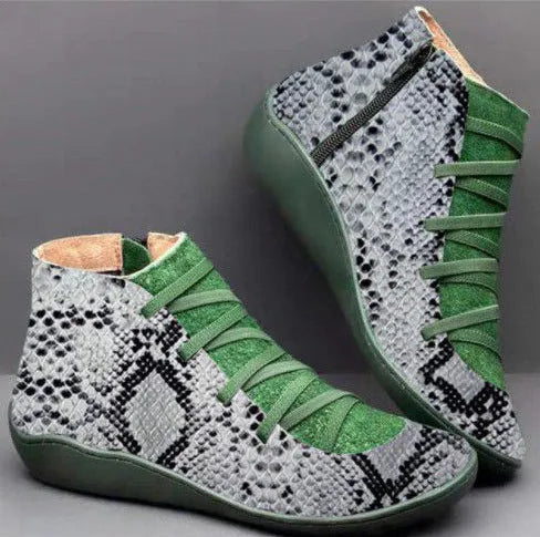 Women's flat wedge heel ankle booties in various colours including leopard print, with round toe and rubber sole.