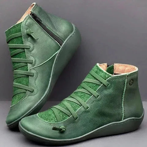 Women's flat wedge heel ankle booties in various colours including leopard print, with round toe and rubber sole.
