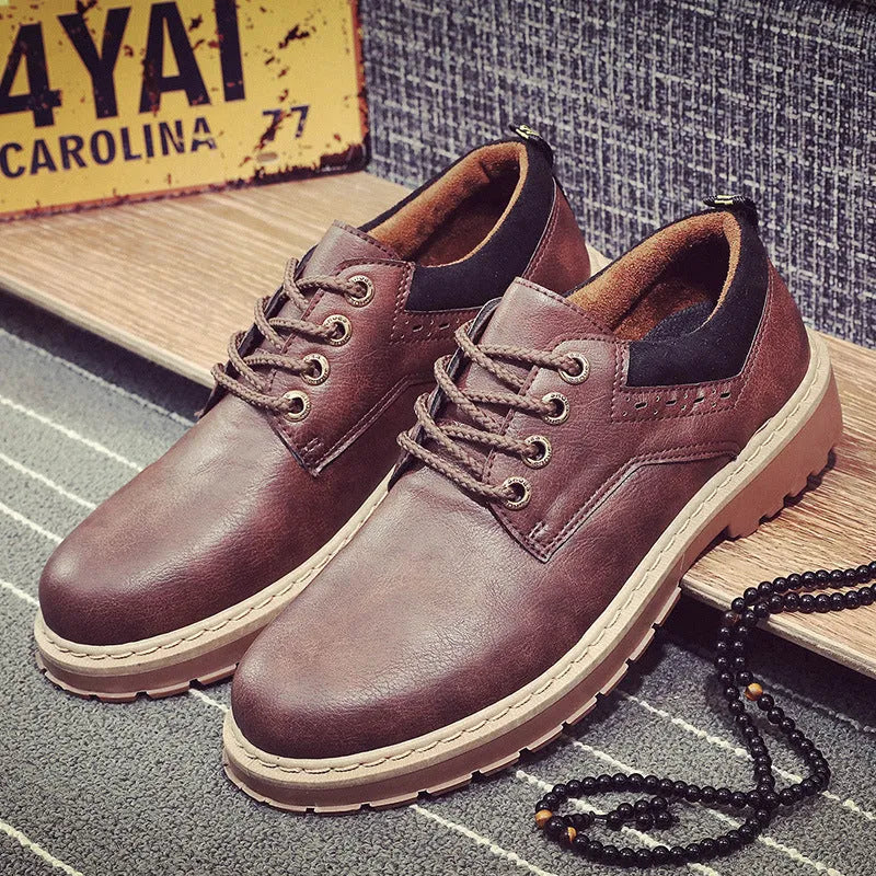 Men's black casual shoes with round toe and front-tie lacing on a rubber sole