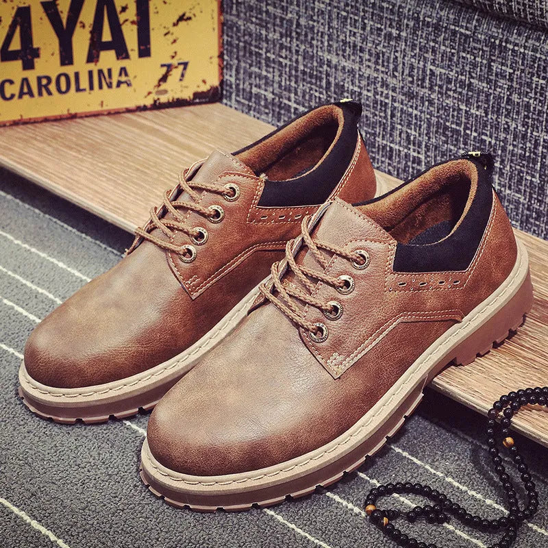 Men's black casual shoes with round toe and front-tie lacing on a rubber sole