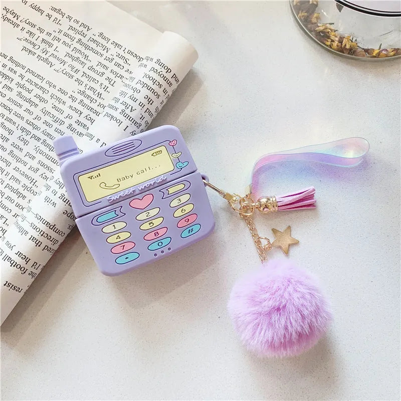 Purple silicone Apple AirPods case with clamshell design and attached fur ball pendant