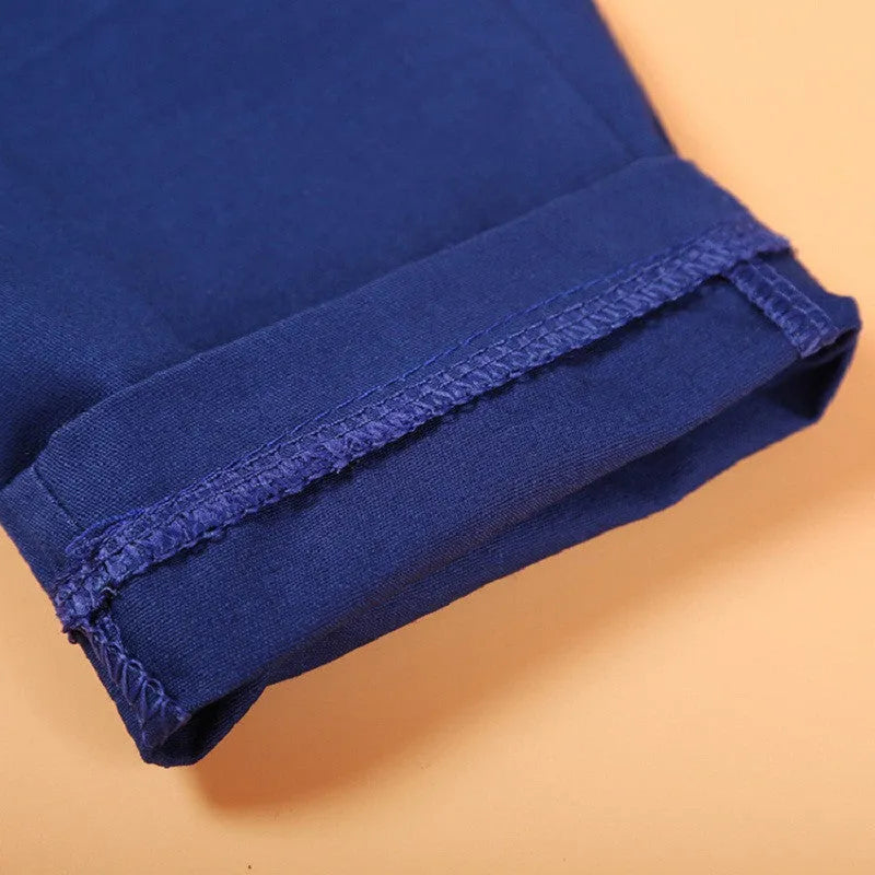 Boys' casual suit clothing set comprising a blue turtleneck, matching vest, tie, and trousers.