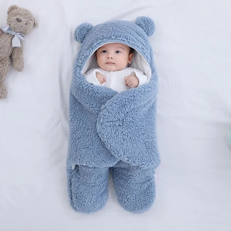 Baby quilted sleeping bag wrapper in cotton blend fabric showing six colour options and three size measurements