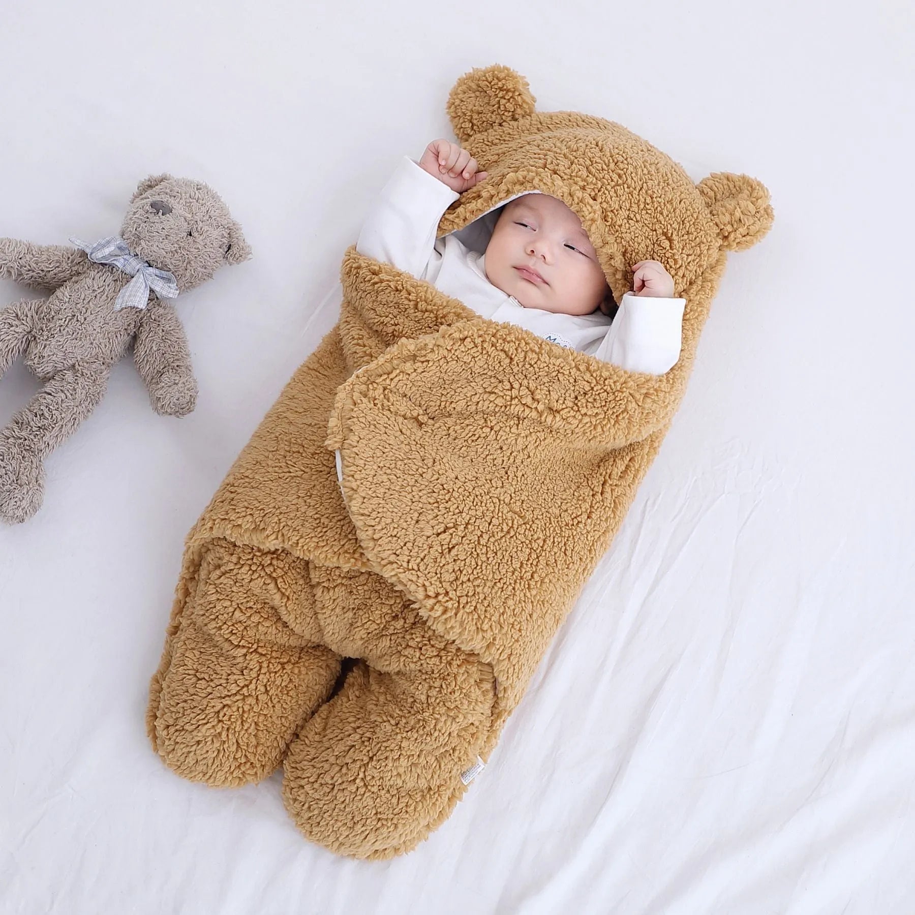 Baby quilted sleeping bag wrapper in cotton blend fabric showing six colour options and three size measurements