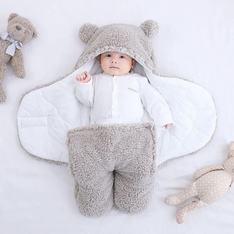Baby quilted sleeping bag wrapper in cotton blend fabric showing six colour options and three size measurements