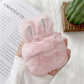 Pink plush silicone AirPods cover with rabbit ears protecting wireless earbuds case