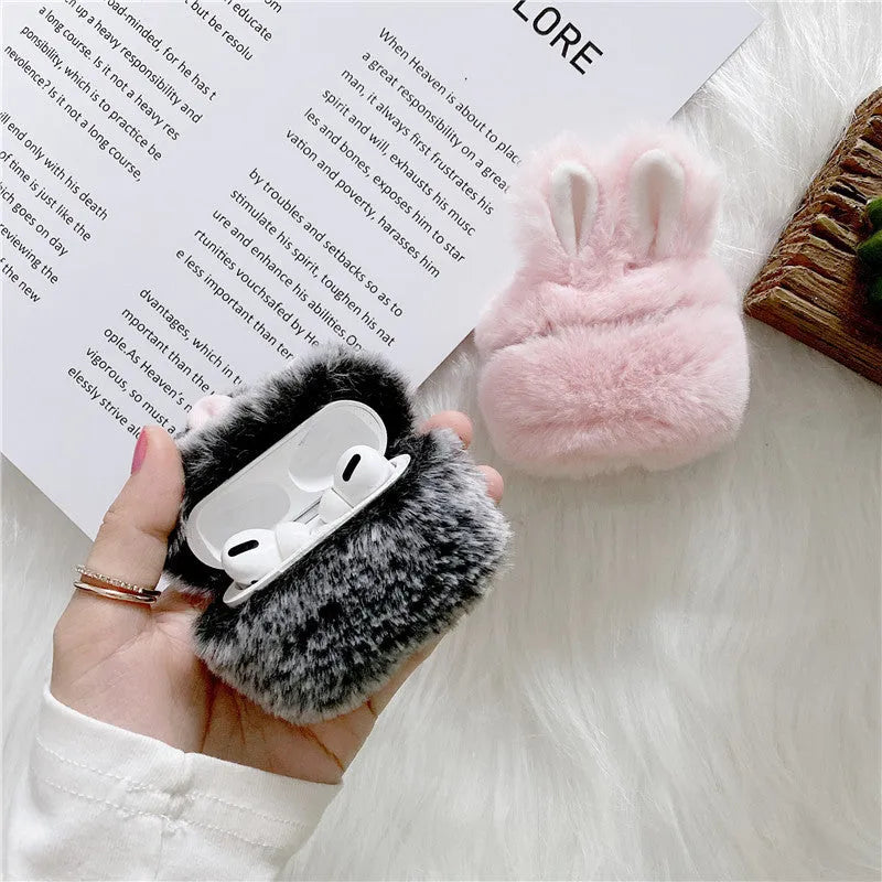 Pink plush silicone AirPods cover with rabbit ears protecting wireless earbuds case