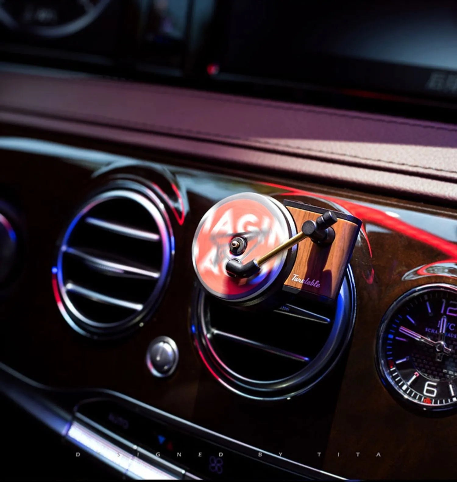Brown alloy car perfume clip with record locomotive design on car air vent