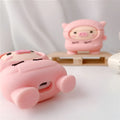 Pink silicone flip cover case for AirPods with a cartoon pig design and a metal keychain hook.