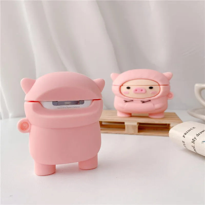 Pink silicone flip cover case for AirPods with a cartoon pig design and a metal keychain hook.