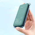Mint green magnetic wireless power bank with back clip showing dimensions 15.5cm x 7.5cm