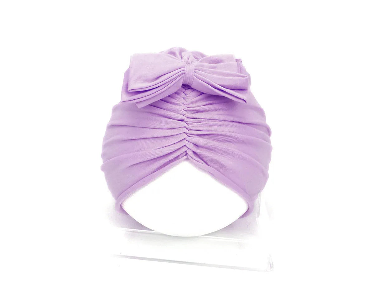 Soft acrylic knitted baby girl turban hat in a solid colour, suitable for newborns to 28 months.