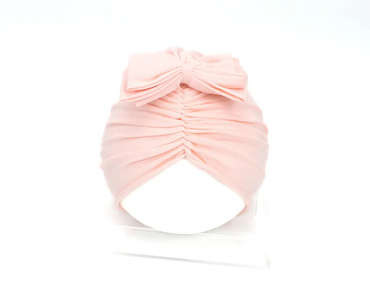 Soft acrylic knitted baby girl turban hat in a solid colour, suitable for newborns to 28 months.