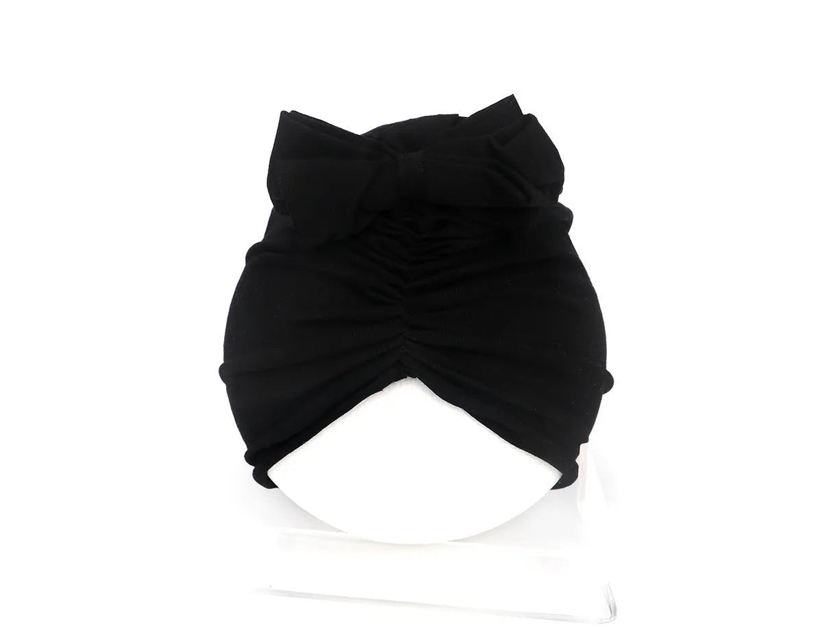 Soft acrylic knitted baby girl turban hat in a solid colour, suitable for newborns to 28 months.
